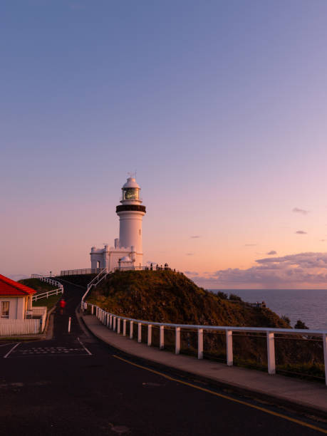Road to lighthouse Street view towards Cape Byron Lighthouse, Australia. byron bay stock pictures, royalty-free photos & images