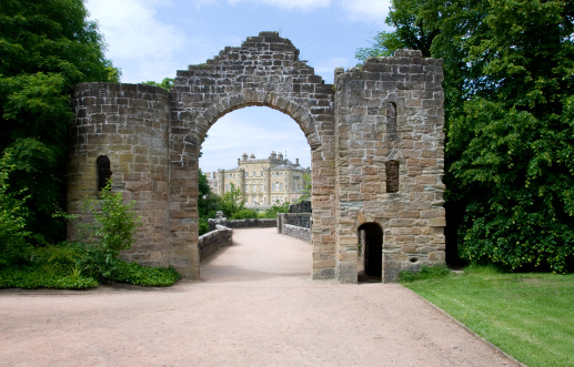 A scene of Culzean castle in Ayrshire Scotland through the old historic entrance gate.