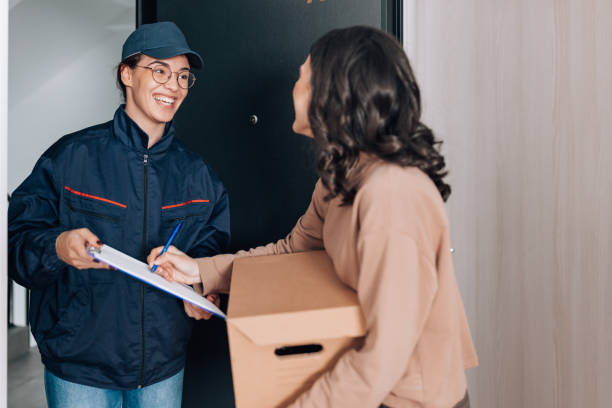 istock Female courier brings the package 1442304720