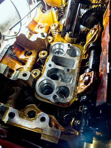 Dissembled Internal combustion engine in a repair shop