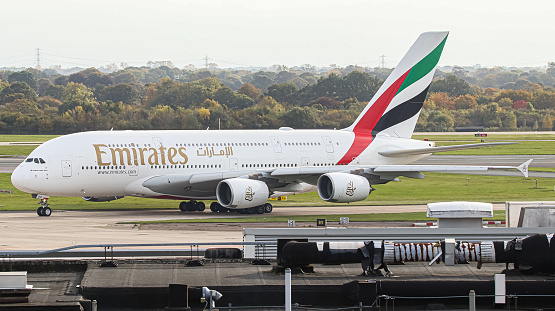Manchester Airport, United Kingdom - 22 October, 2022: Emirates Airbus A380 (A6-EOH) taxiing towards runway 23R for take off to Dubai, United Arab Emirates.