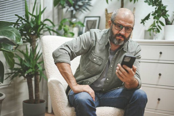 istock businessman working in the home office (laptop, mobile phone) 1442306539