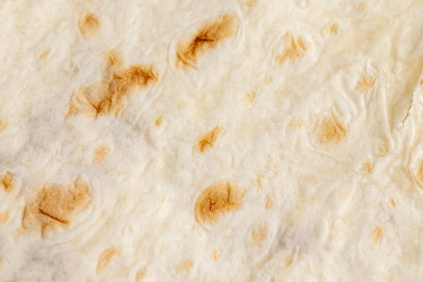 istock Wheat pita bread with dark spots 1442306640