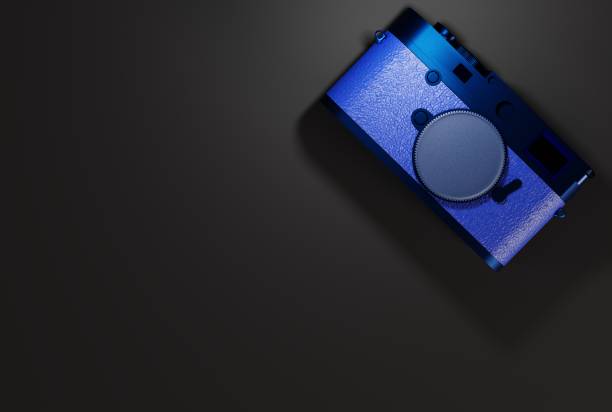 istock Retro photo camera on a dark background. 1442309652