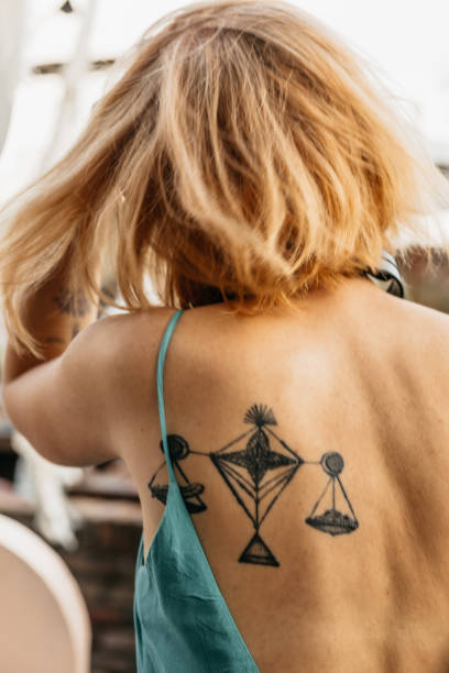 istock Close-up of a young womans tattooed back 1442310226