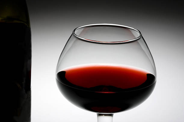 istock Red wine bottle and glass 144231081
