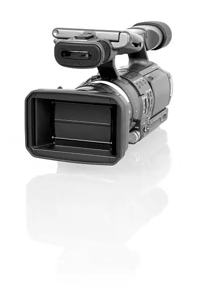 Camcorder: front view; delicate glass-reflection underneath, sharp focus, 