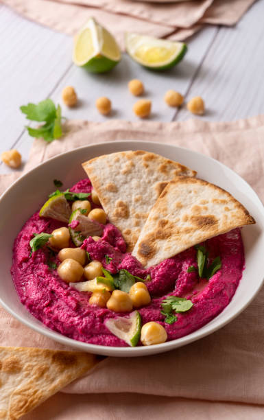 istock Close-up of Beetroot hummus on white table 1442320758