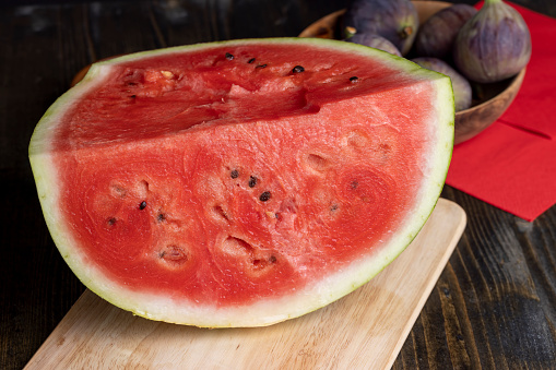 Sliced ripe and juicy watermelon of red color, pieces of ripe red watermelon divided into parts