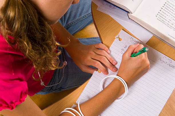 istock Young Girl at desk in school 144232225