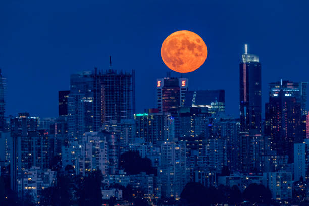 istock full moon rising above Downtown Vancouver, BC, Canada 1442322404