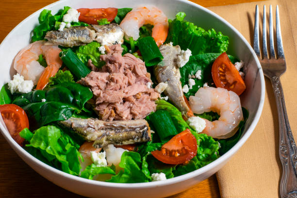 istock salad top with  tuna, shrimp and sardines 1442323539