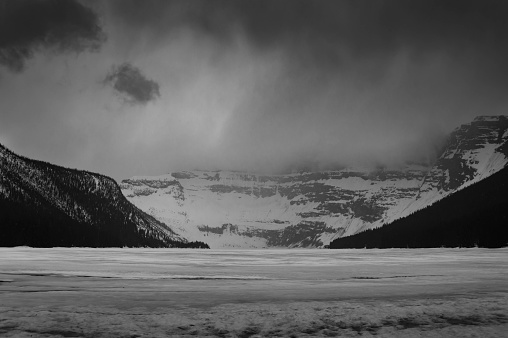 dramatic view of Cameron lake under cloudy sky in Waterton National park, Alberta, Canada