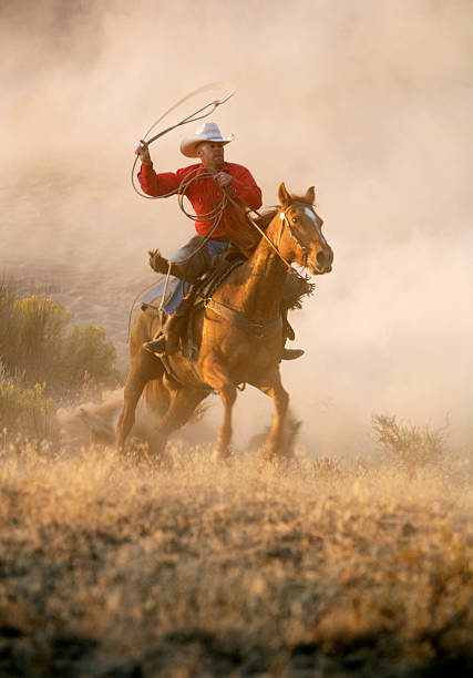 vaquero en acción - pantalones de cuero rojos fotografías e imágenes de stock