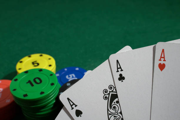 istock Winning a bet with a hand full of aces 1442330998