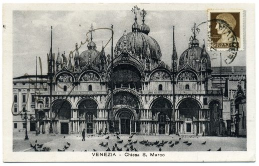 Venezia! Beautiful Antique postcard of Venice, Italy. Black and white photograph of St. Marks Cathedral, with plenty of pigeons. Nicely cancelled Italian stamp, in brown, along with cursive fountain pen signature. From a collectable.