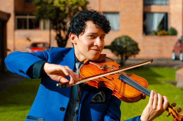 istock Man playing the violin outside 1442332108