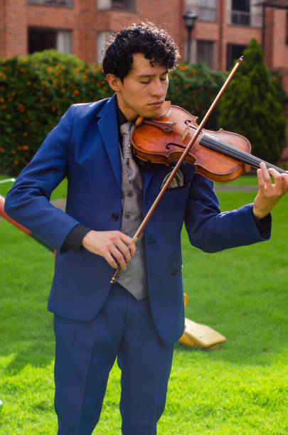 istock Man playing the violin outside 1442332136