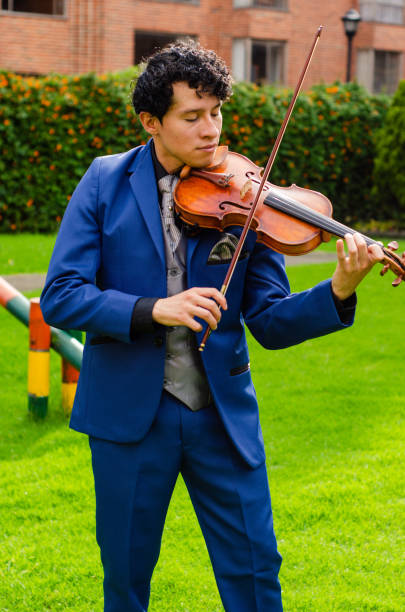 istock Man playing the violin outside 1442332157