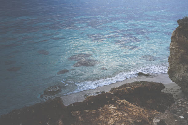 Typical beach with sand and rocks in the Italian coast