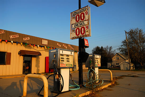 Abandoned gas station Abandoned gas station along rural highway in the morning. vintage gas pumps stock pictures, royalty-free photos & images