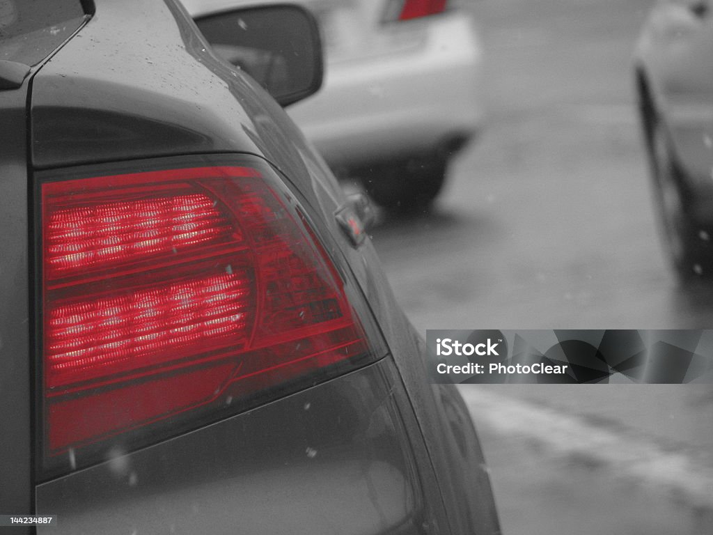 taillight I was stuck in a traffic jam one evening and decided to take a picture of the car in front of me. This clear photo of the color accented taillight and snowflakes falling down is one of my favorites! Black And White Stock Photo