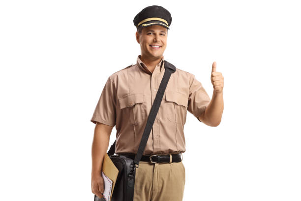 istock Mailman with a bag standing and gesturing a thumb up sign 1442361852