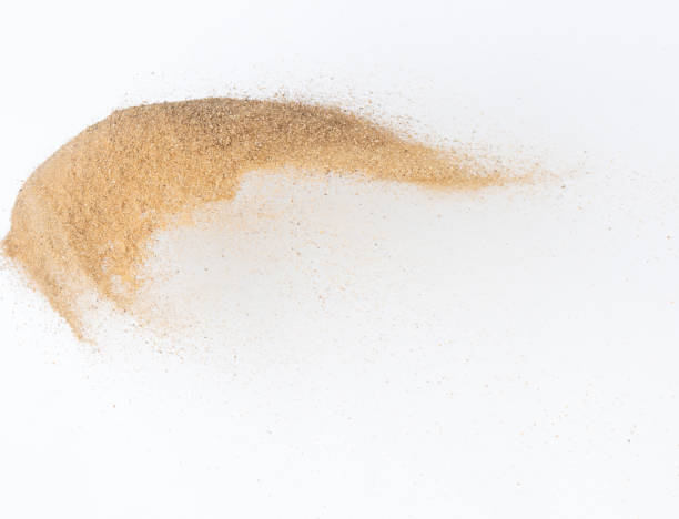 istock Sand flying explosion, Golden sand wave explode. Abstract sands cloud fly. Yellow colored sand splash throwing in Air. White background Isolated high speed shutter, throwing freeze stop motion 1442366859