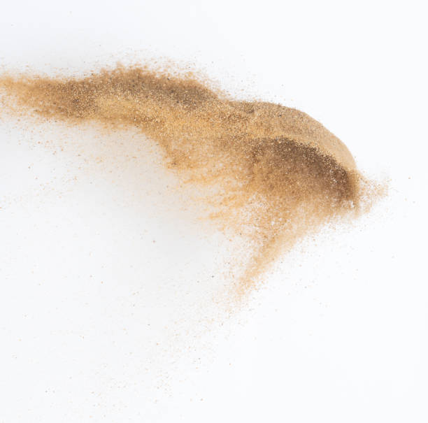 istock Sand flying explosion, Golden sand wave explode. Abstract sands cloud fly. Yellow colored sand splash throwing in Air. White background Isolated high speed shutter, throwing freeze stop motion 1442367038