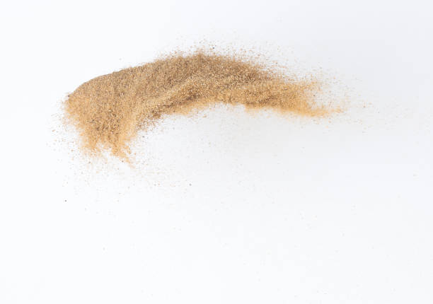 istock Sand flying explosion, Golden sand wave explode. Abstract sands cloud fly. Yellow colored sand splash throwing in Air. White background Isolated high speed shutter, throwing freeze stop motion 1442367342