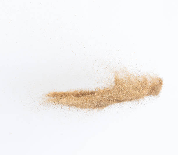 istock Sand flying explosion, Golden sand wave explode. Abstract sands cloud fly. Yellow colored sand splash throwing in Air. White background Isolated high speed shutter, throwing freeze stop motion 1442367601