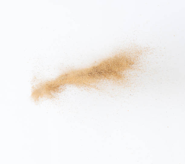 istock Sand flying explosion, Golden sand wave explode. Abstract sands cloud fly. Yellow colored sand splash throwing in Air. White background Isolated high speed shutter, throwing freeze stop motion 1442367681