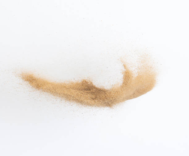 istock Sand flying explosion, Golden sand wave explode. Abstract sands cloud fly. Yellow colored sand splash throwing in Air. White background Isolated high speed shutter, throwing freeze stop motion 1442367894
