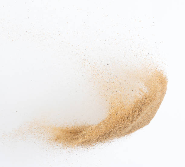istock Sand flying explosion, Golden sand wave explode. Abstract sands cloud fly. Yellow colored sand splash throwing in Air. White background Isolated high speed shutter, throwing freeze stop motion 1442368133