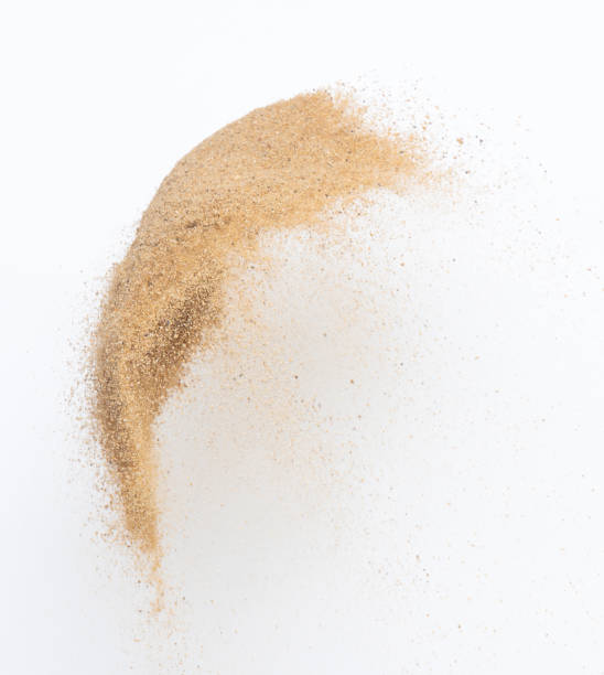 istock Sand flying explosion, Golden sand wave explode. Abstract sands cloud fly. Yellow colored sand splash throwing in Air. White background Isolated high speed shutter, throwing freeze stop motion 1442368214