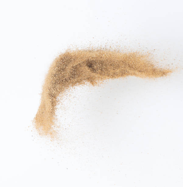 istock Sand flying explosion, Golden sand wave explode. Abstract sands cloud fly. Yellow colored sand splash throwing in Air. White background Isolated high speed shutter, throwing freeze stop motion 1442368249