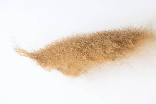 istock Sand flying explosion, Golden sand wave explode. Abstract sands cloud fly. Yellow colored sand splash throwing in Air. White background Isolated selective focus, throwing motion Blur 1442368542