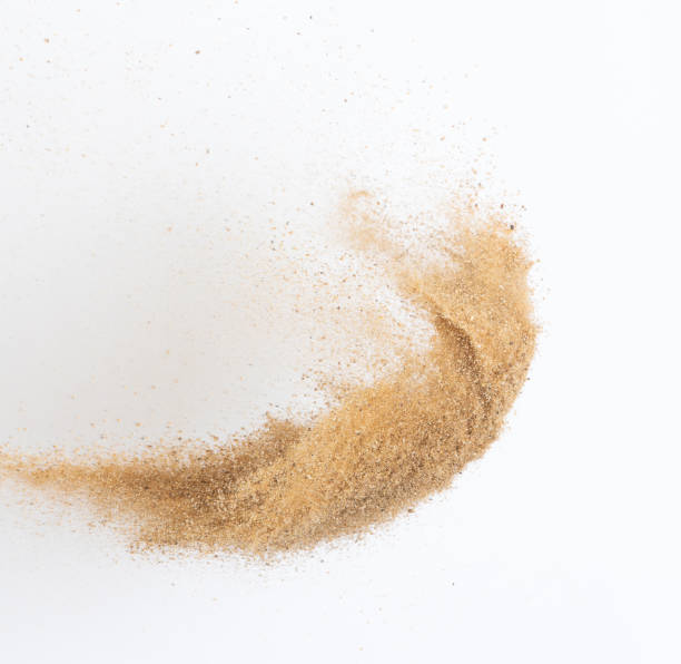 istock Sand flying explosion, Golden sand wave explode. Abstract sands cloud fly. Yellow colored sand splash throwing in Air. White background Isolated high speed shutter, throwing freeze stop motion 1442368569