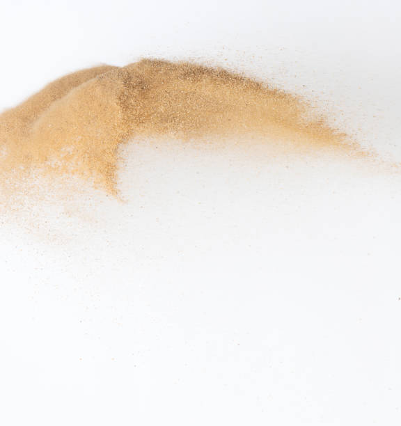 istock Sand flying explosion, Golden sand wave explode. Abstract sands cloud fly. Yellow colored sand splash throwing in Air. White background Isolated high speed shutter, throwing freeze stop motion 1442368629