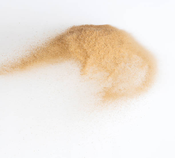 istock Sand flying explosion, Golden sand wave explode. Abstract sands cloud fly. Yellow colored sand splash throwing in Air. White background Isolated high speed shutter, throwing freeze stop motion 1442368665