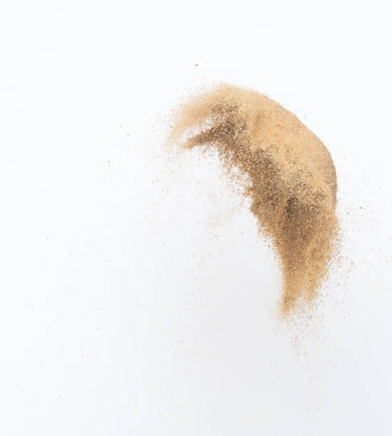 istock Sand flying explosion, Golden sand wave explode. Abstract sands cloud fly. Yellow colored sand splash throwing in Air. White background Isolated high speed shutter, throwing freeze stop motion 1442368863