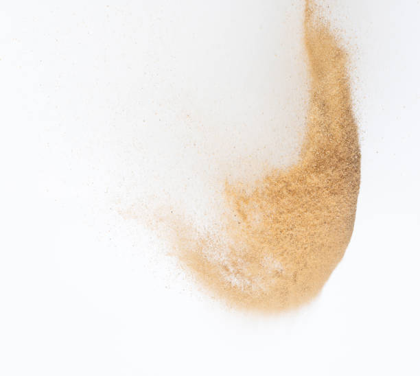 istock Sand flying explosion, Golden sand wave explode. Abstract sands cloud fly. Yellow colored sand splash throwing in Air. White background Isolated high speed shutter, throwing freeze stop motion 1442369494