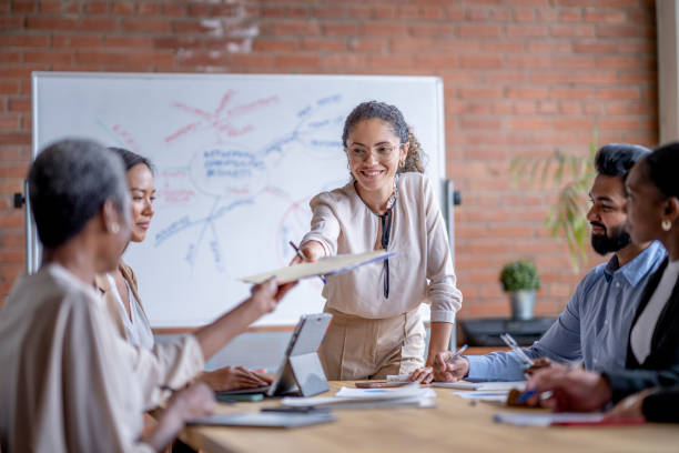 istock Woman Leading a Business Meeting 1442369607
