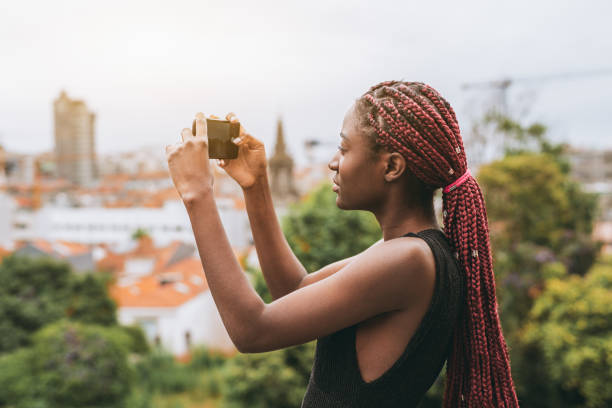 istock Black girl taking pics on smartphone 1442374163