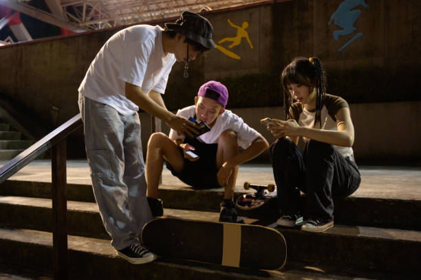 istock Skateboarders Hanging Out In Skate Park 1442374287