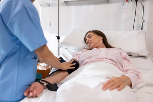 istock Sick woman getting her blood pressure checked while being hospitalized 1442374645