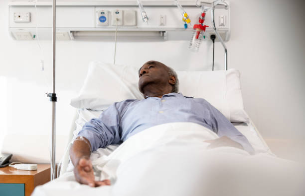 istock Sick man lying in bed at the hospital 1442374663