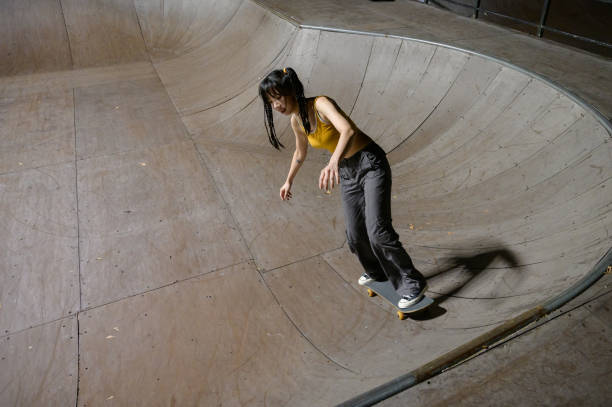 istock Young Woman Skateboarding in Skatepark 1442374724