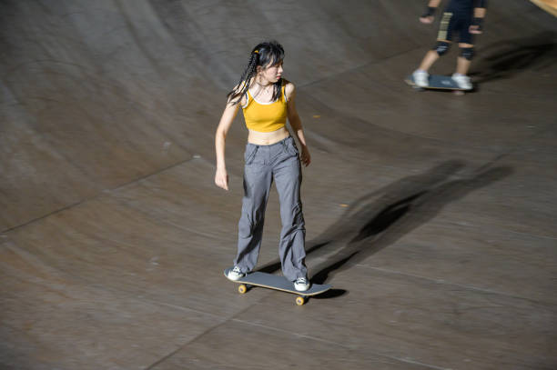 istock Young Woman Skateboarding in Skatepark 1442375949