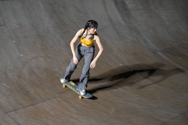 istock Young Woman Skateboarding in Skatepark 1442375963